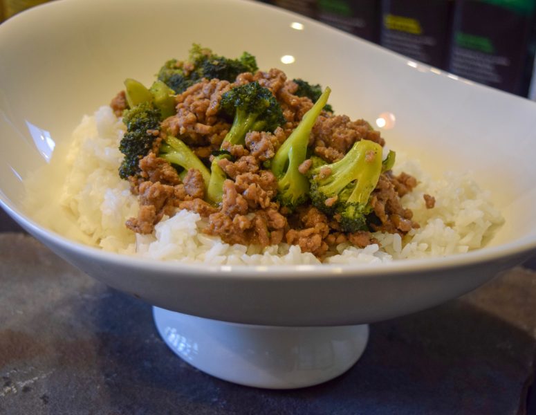 A bowl filled with rice, tender meat, and vibrant broccoli, creating a colorful and appetizing meal.