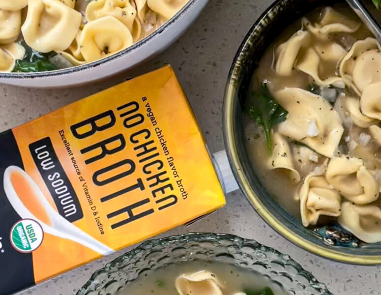 A warm bowl of slow cooker chicken noodle soup, featuring tender chicken, noodles, and fresh vegetables in a savory broth.