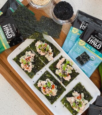 A plate of Seaweed Snacks with tuna, green onions, hot sauce with Ocean’s Halo Seaweed Snacks next to it