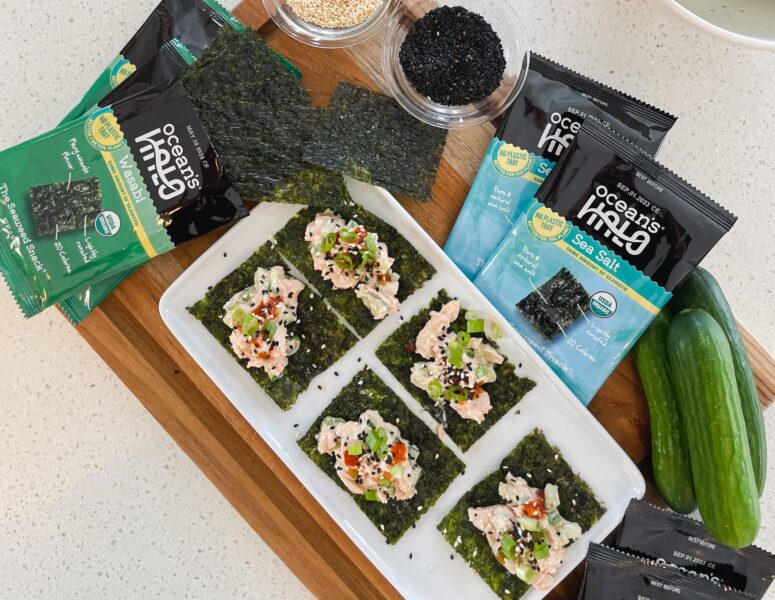 A plate of Seaweed Snacks with tuna, green onions, hot sauce with Ocean’s Halo Seaweed Snacks next to it